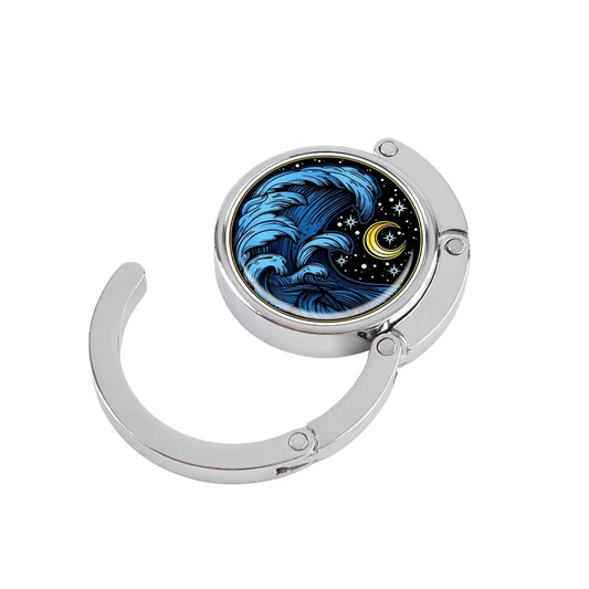 NOOX Ocean Soul foldable metal bag hanger featuring a blue wave and starry night design on a black background